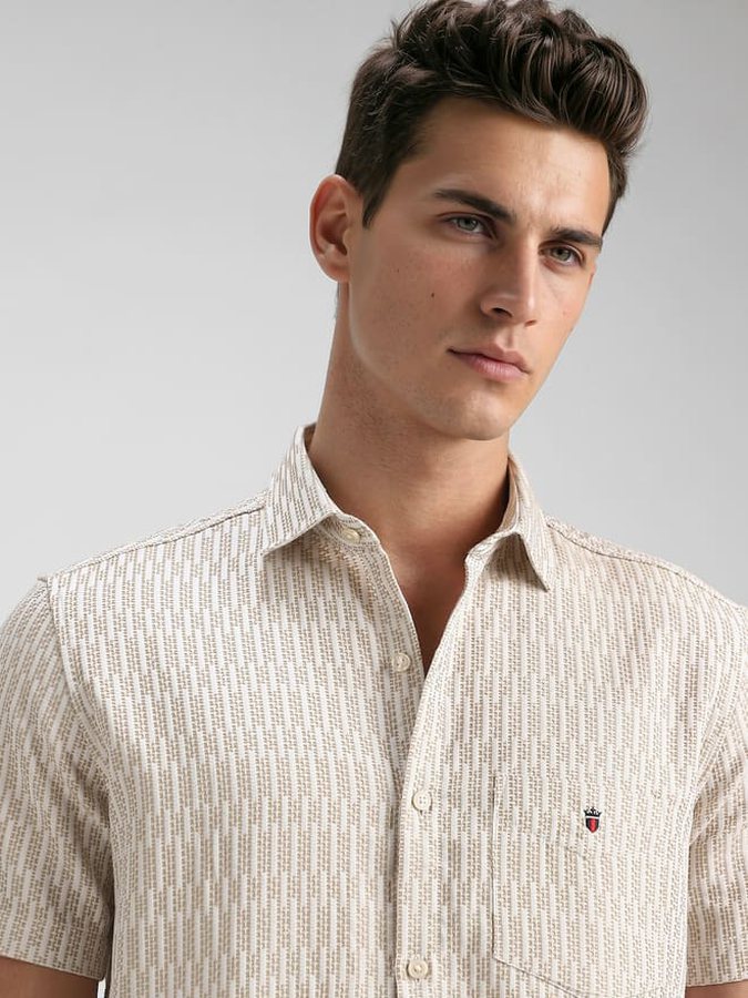 Catalogue model in a cream patterned shirt, close crop