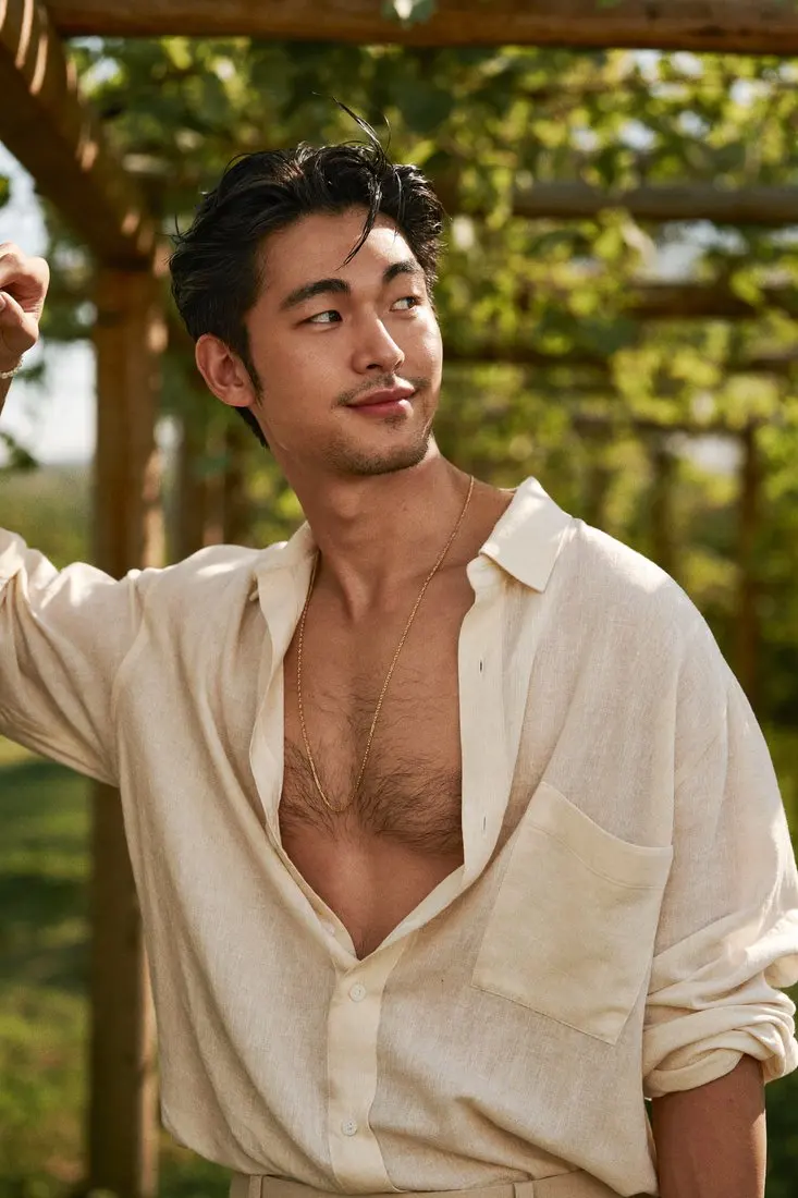 Before: person in a linen shirt under a vineyard pergola, face and hair as photographed