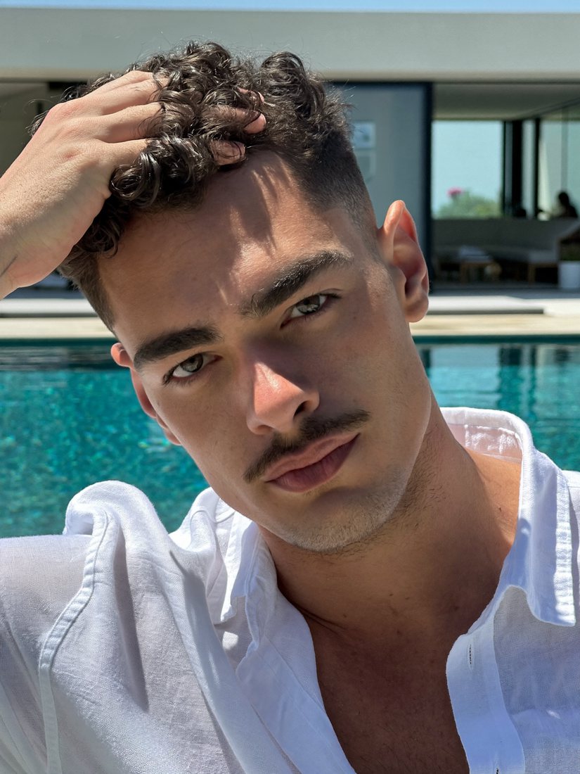 Model by a swimming pool, head swapped, pool and pose unchanged
