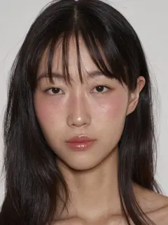 New head: woman with straight black hair and bangs