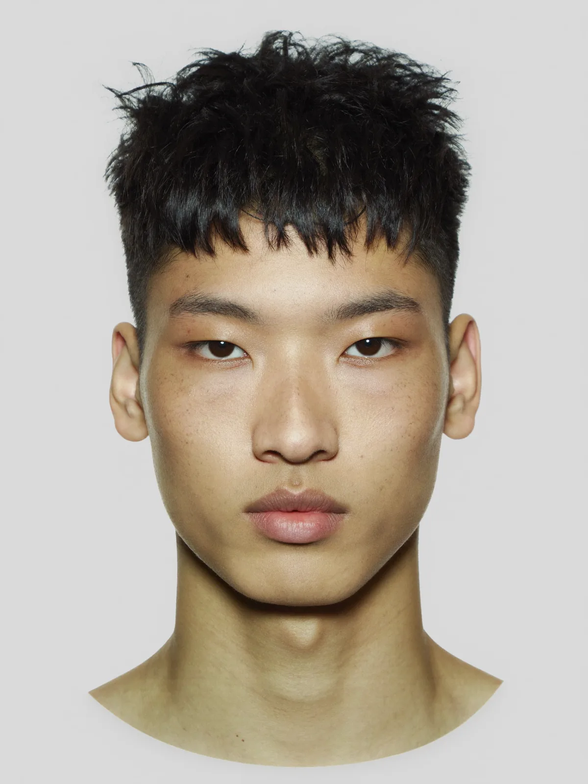 Reference face: portrait photo of the head used for the crouching skateboard photo